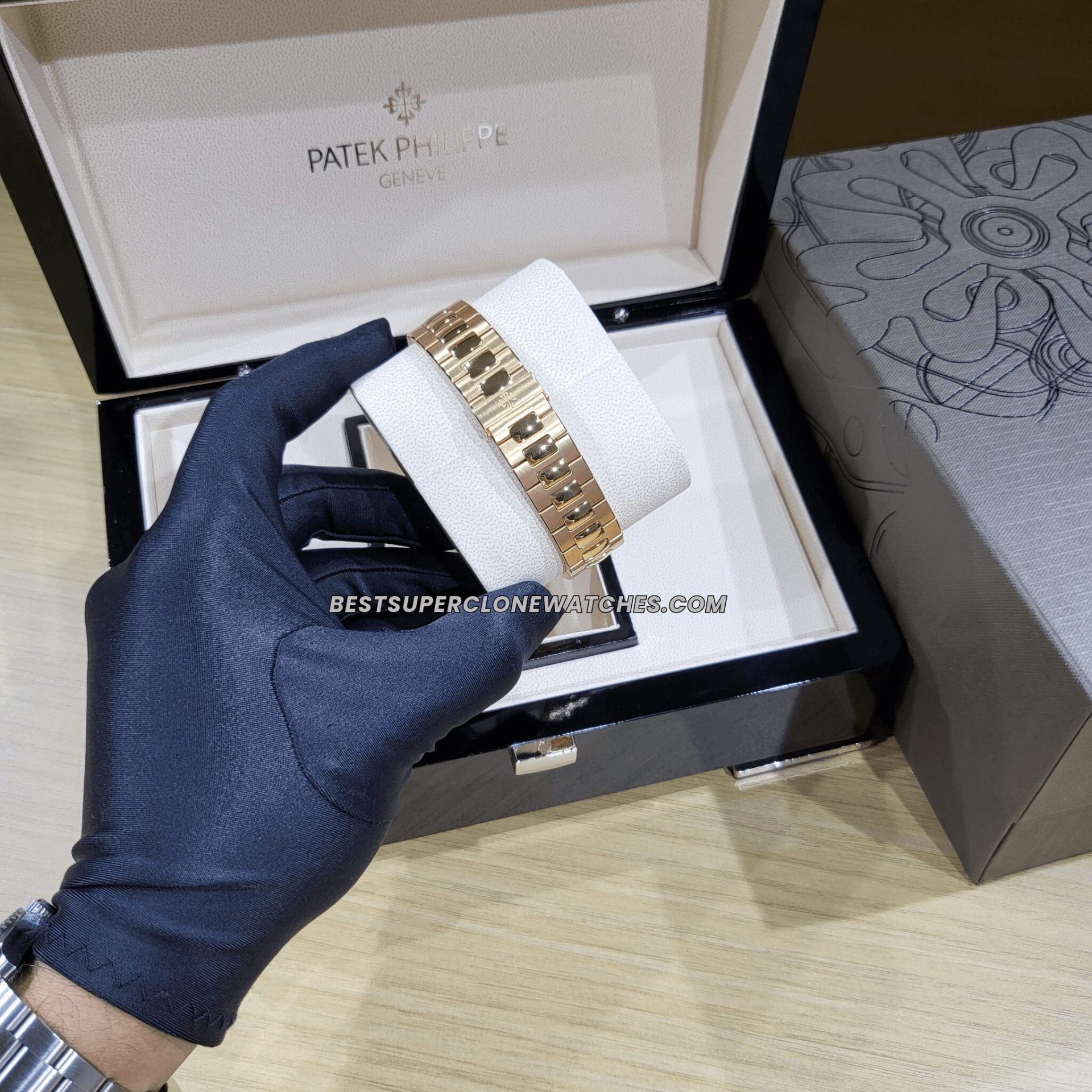 Replica Patek Philippe Nautilus watch in rose gold with brown dial and baton markers