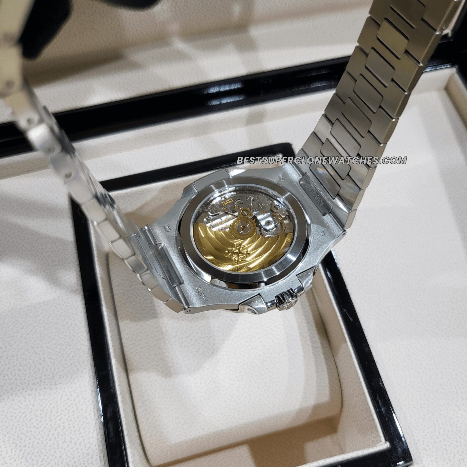 Fake Patek Philippe 5811 with vibrant sunburst blue dial and polished steel-like case