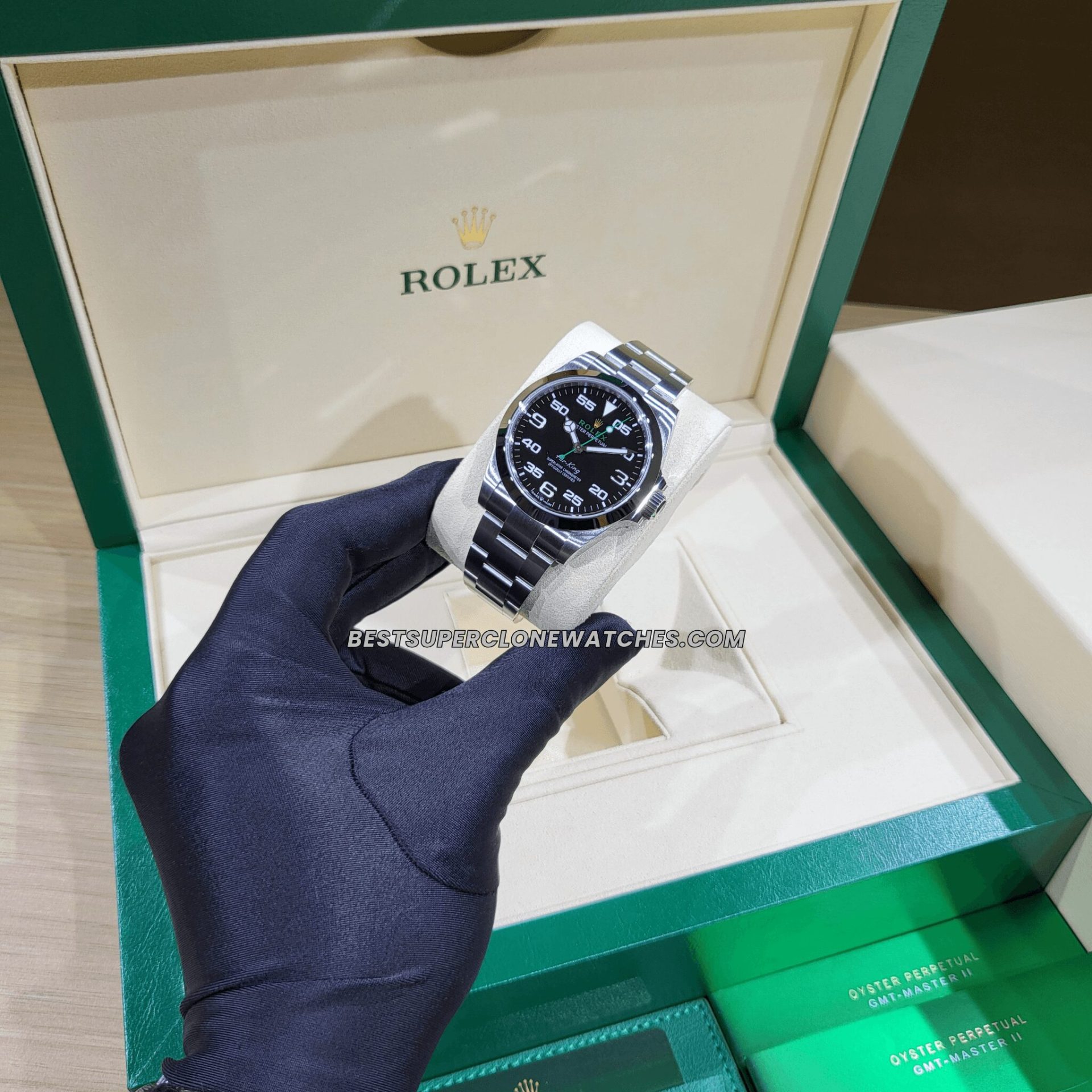 Super clone Rolex Air-King 126900 featuring black dial with white numerals and stainless steel case
