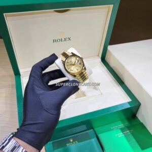 High-quality replica of Rolex Day-Date featuring champagne dial and fluted bezel