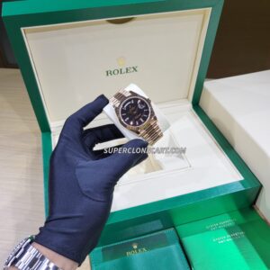 High-quality replica of Rolex Day-Date featuring rose gold case and diamonds on Eisenkiesel dial