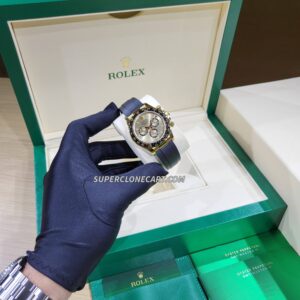 Luxury fake Rolex Daytona with golden dial and chronograph functions on oysterflex strap