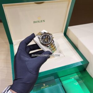 Replica Rolex Daytona featuring 4131 clone movement and two-tone yellow Rolesor with black dial