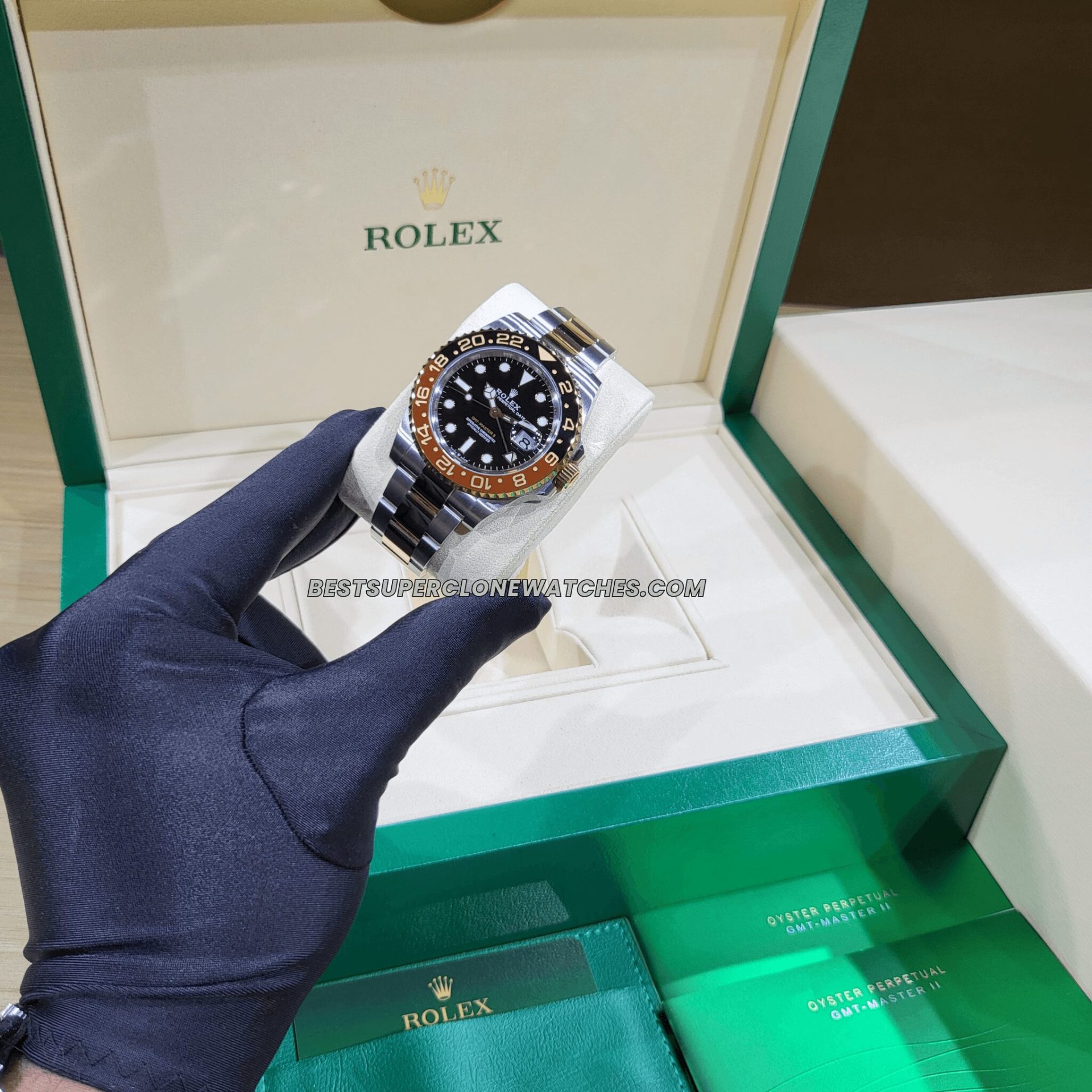 Luxury fake Rolex GMT Master II featuring Rootbeer brown and black bezel with 2-tone bracelet