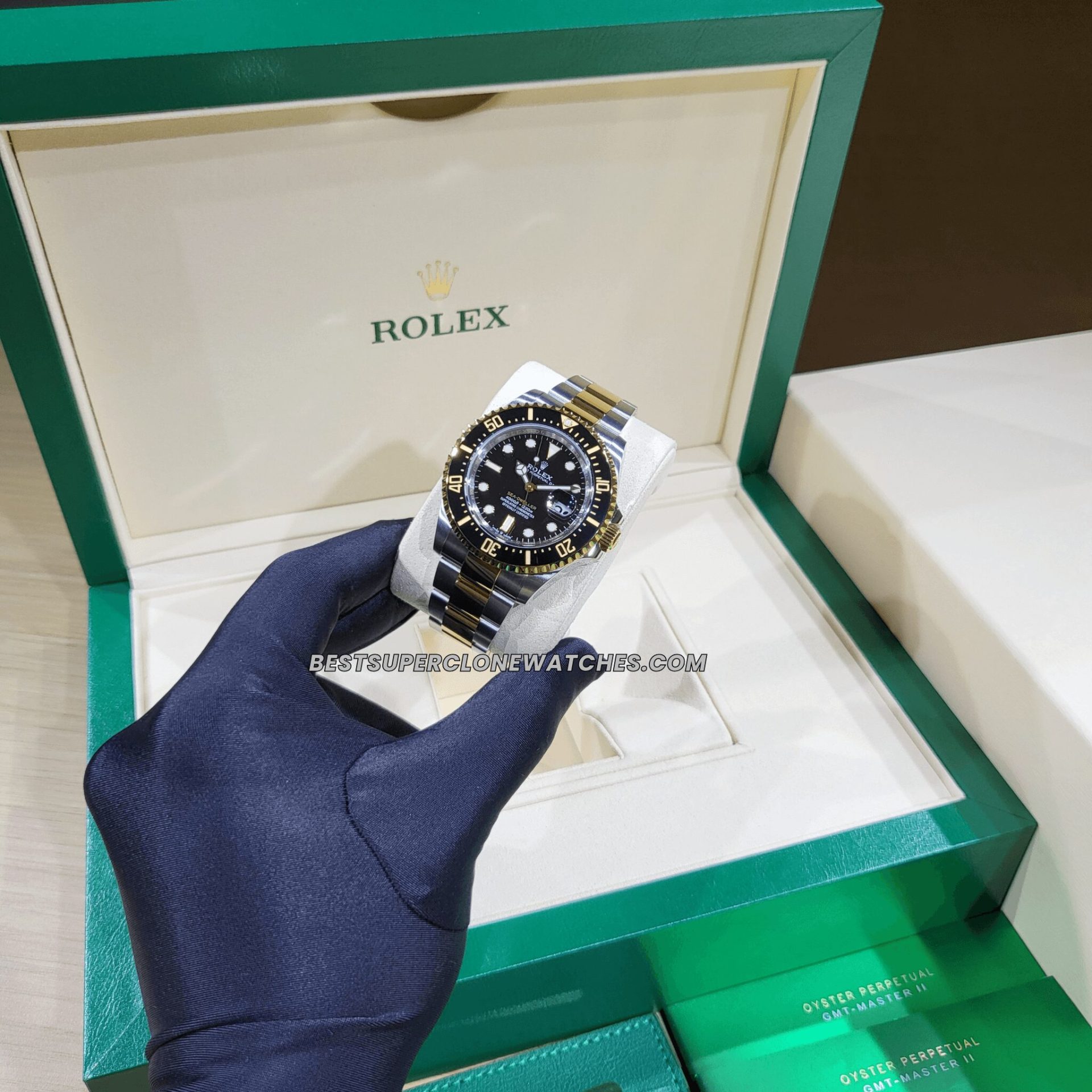 Swiss super clone Rolex Sea-Dweller 126603 with bold black dial, luminous hands, and two-tone gold-steel case