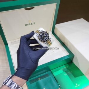 High-quality replica Rolex Sea-Dweller showing yellow gold bezel and robust Oystersteel case