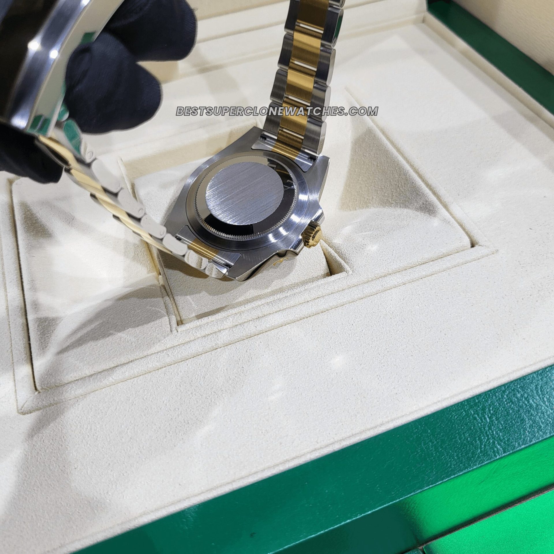 Detailed view of 126613LB replica Rolex with magnified date and luminous markers